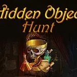 Lobanja z zlatim trakom in metuljčkom, drži zeleni kristal, naslov Hidden Object Hunt