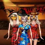 Tri ženske oblečene v kostume za noč čarovnic v sobi z napisom Happy Halloween