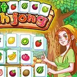 Igra Fruit Mahjong s sadjem na ploščicah in risana ženska v zeleni majici